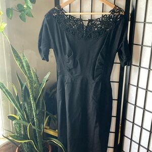 Vintage black dress with lace neckline, puckered waist and sleeves, zipper back